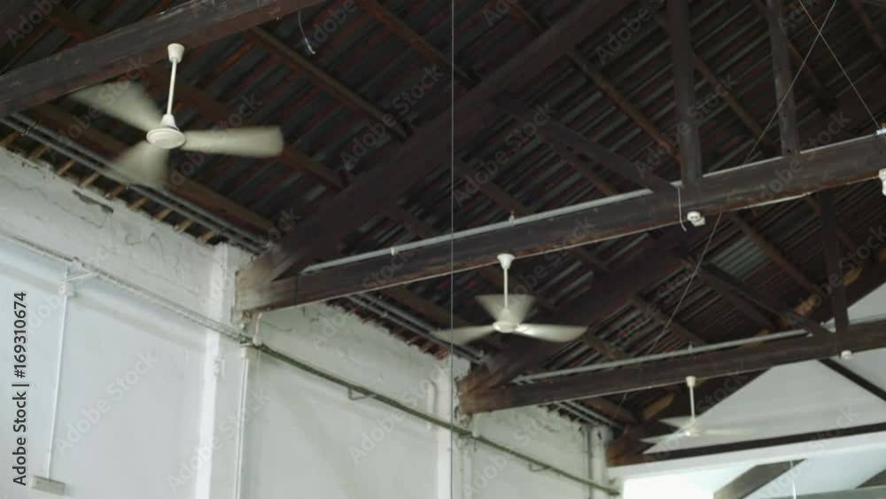Three air conditioner ventilators or ceiling fans are cooling air and creating wind flow or stream to cool down hot room or industrial production building Three air conditioner ventilators or ceiling fans are cooling air and creating wind flow or stream to cool down hot room or industrial production building