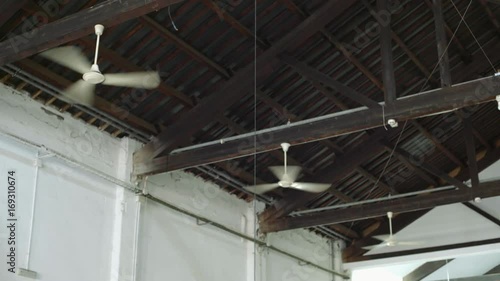 Wallpaper Mural Three air conditioner ventilators or ceiling fans are cooling air and creating wind flow or stream to cool down hot room or industrial production building Torontodigital.ca