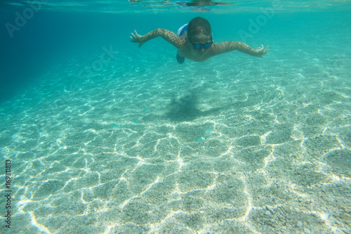 Child swimming underwater