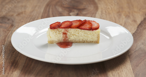 cheesecake with strawberry on plate