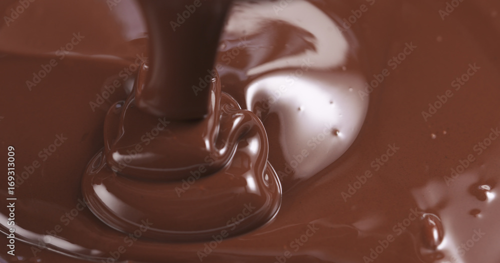 pouring melted premium dark chocolate pouring melted premium dark chocolate