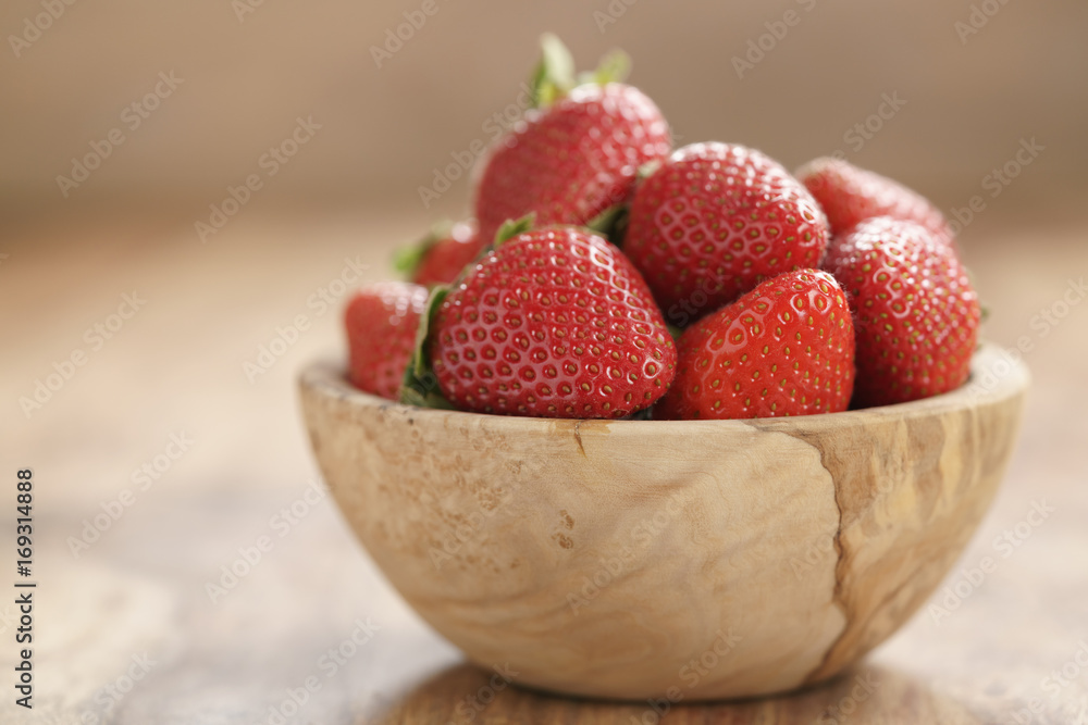 fresh strawberries in bowl on wood table fresh strawberries in bowl on wood table