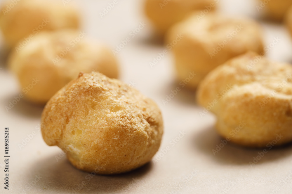profiteroles on brown paper closeup profiteroles on brown paper closeup