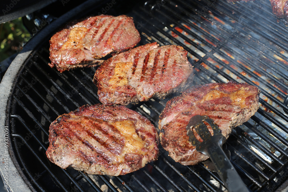 BBQ grill steaks grilled meat on the flame