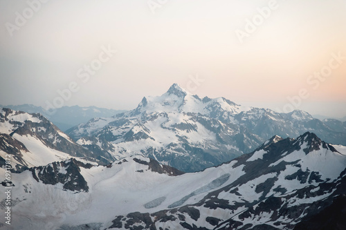 View of the surrounding Elbrus mountains from a height of 3800m at sunset