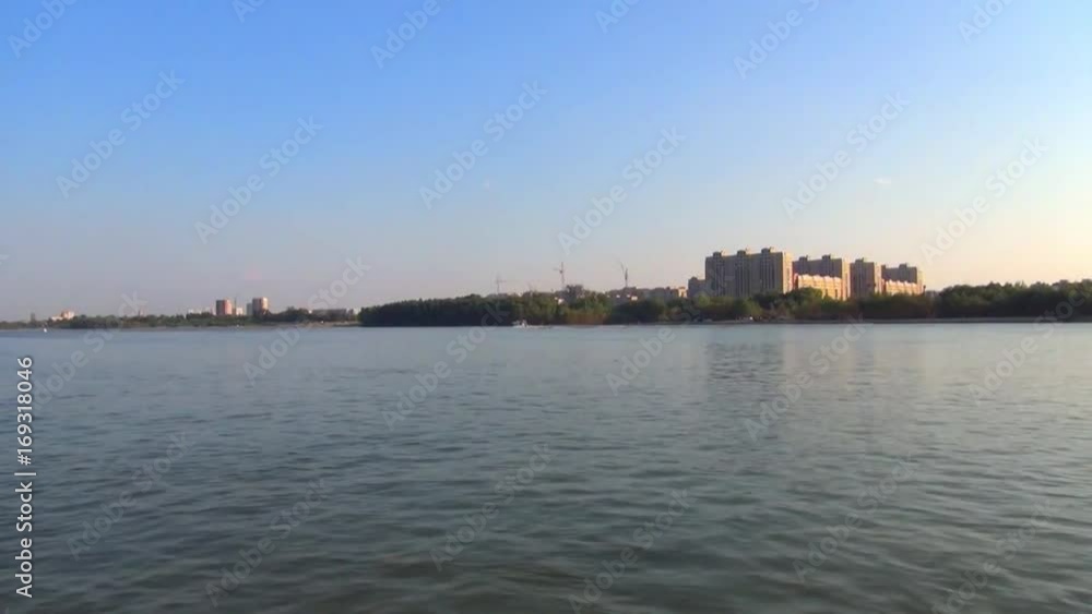 coast near the Siberian city from the deck of a river boat coast near the Siberian city from the deck of a river boat