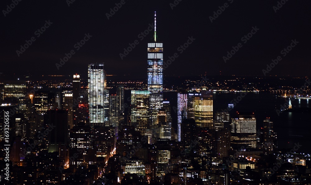 The Freedom Tower, Financial District, and the skyline of downtown Manhattan at night. 