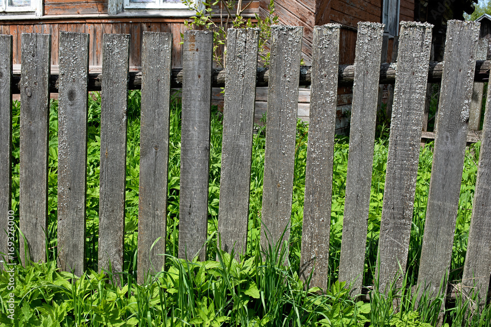 Old gray wooden fence in the village Old gray wooden fence in the village