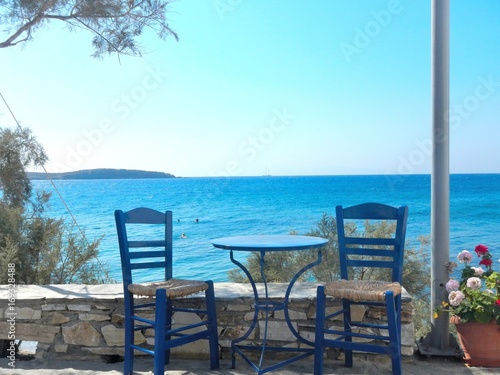 Image showing  table and chairs of a traditional tavern at a Greek island.