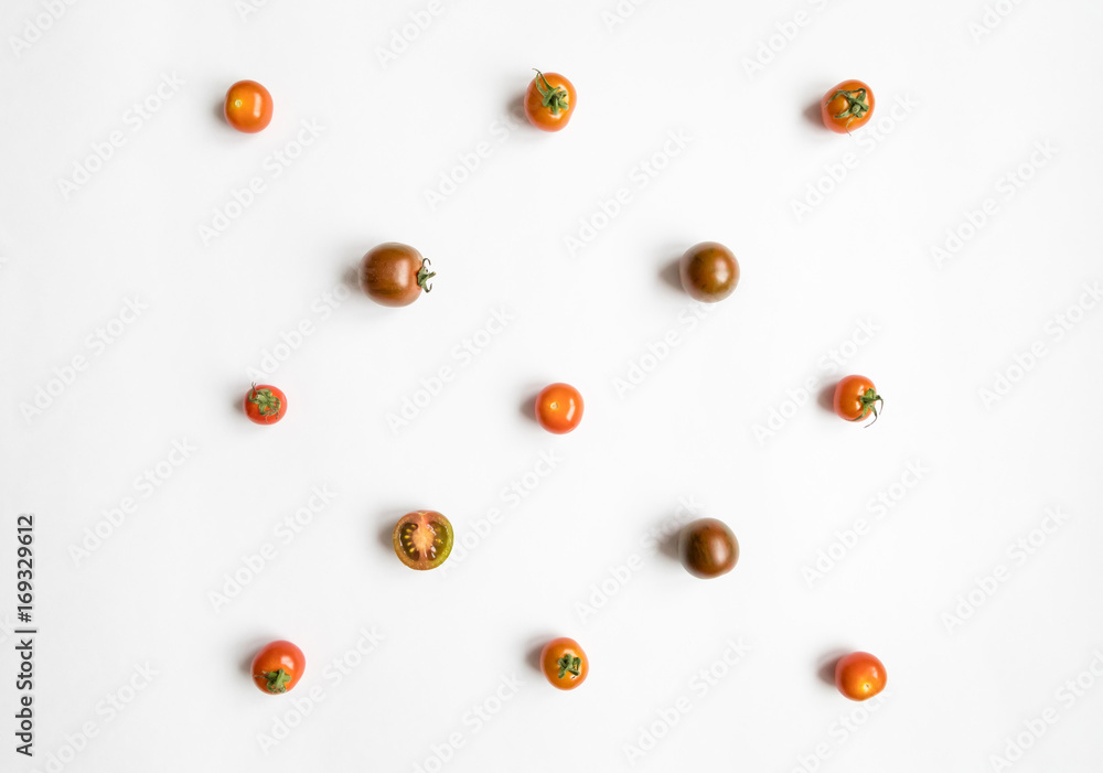 Cherry tomatoes pattern in a square on white background. Flat lay, top view Cherry tomatoes pattern in a square on white background. Flat lay, top view