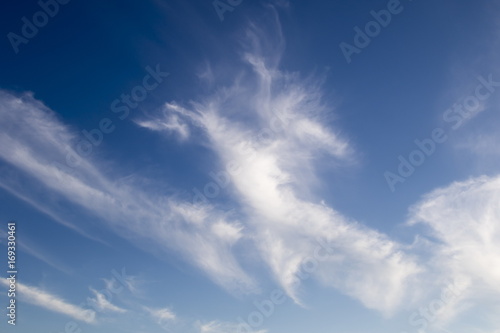 Cirrus clouds on the blue sky background