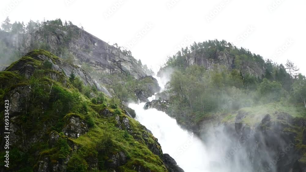 Waterfall in mountains of Norway in rainy weather. Waterfall in mountains of Norway in rainy weather.