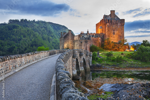 Eilean Donan Castle, Scotland, reflecting itself into the water during evening.