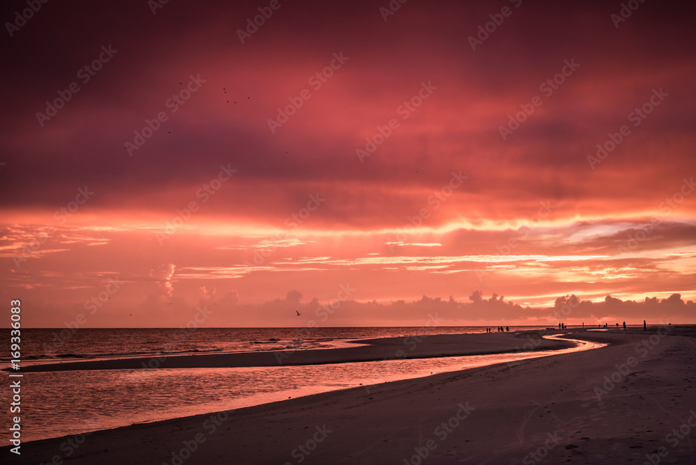 Sunset Walking down the beach 