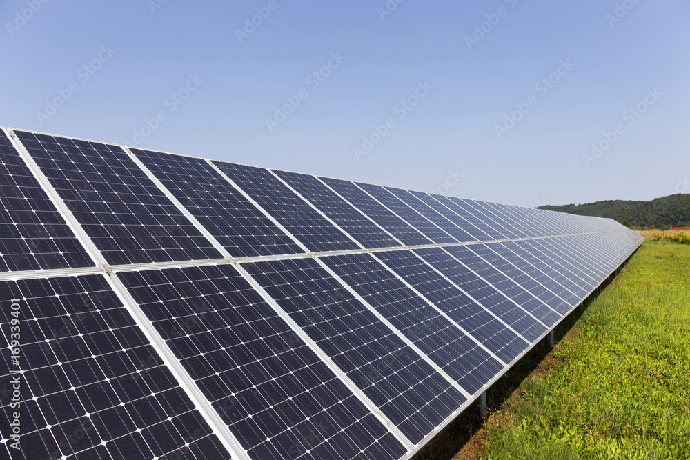 Solar Power Station on the summer flowering Meadow Solar Power Station on the summer flowering Meadow