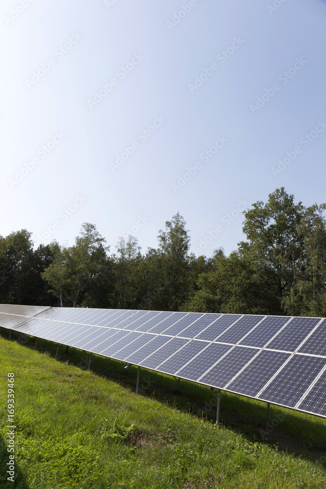 Solar Power Station on the summer flowering Meadow Solar Power Station on the summer flowering Meadow