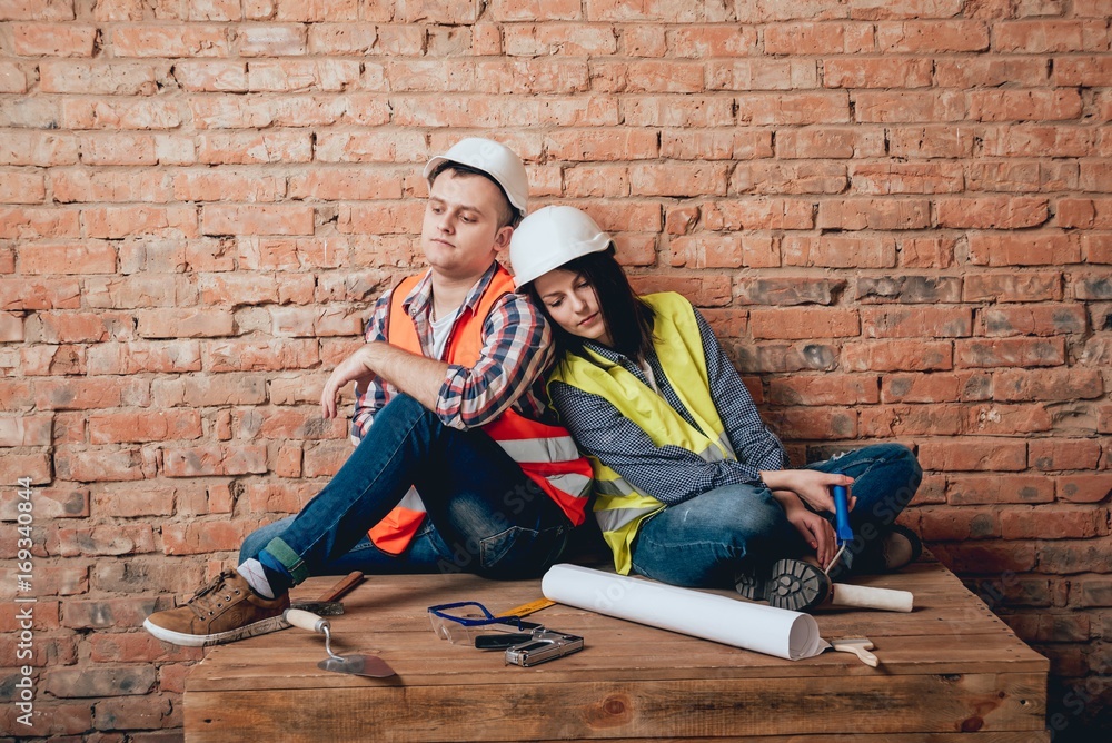 Happy couple making repairs to their home. Happy couple making repairs to their home.
