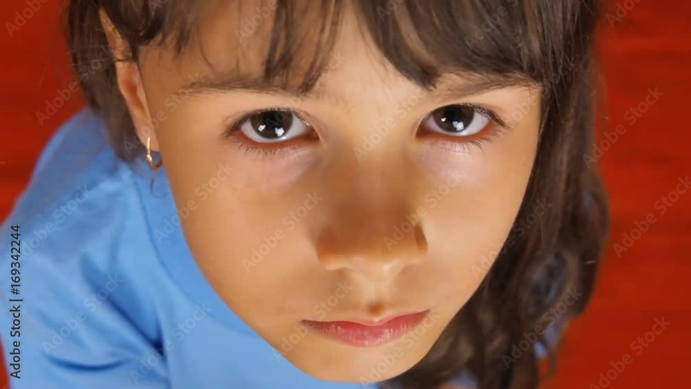 Sad face of a child close-up. Face of a little girl close-up. Sad face of a child close-up. Face of a little girl close-up.