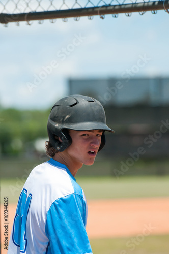 Serious high school baseball player in dugout © tammykayphoto