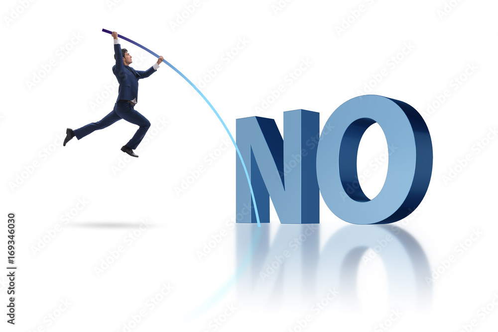 Businessman vaulting over word no Businessman vaulting over word no