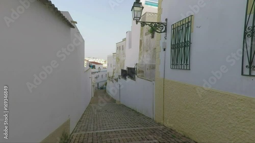 Ancient streets from the stone sidewalk, city of Albufeira. photo