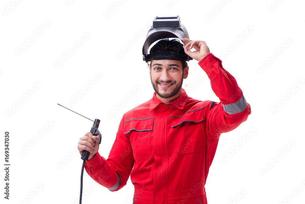 Young repairman with a welding gun electrode and a helmet isolat Young repairman with a welding gun electrode and a helmet isolat