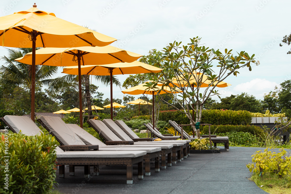 Outdoor beach chairs and yellow umbrellas