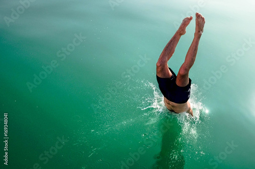 Diving and jumping from a boat at Balaton lake in Hungary photo