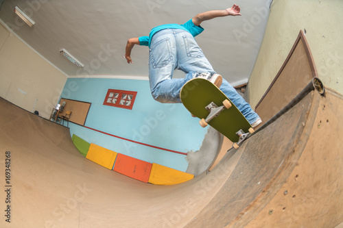 Skateboarder performing a trick photo