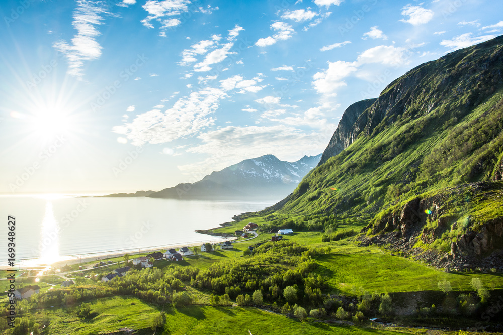 Green valley by water