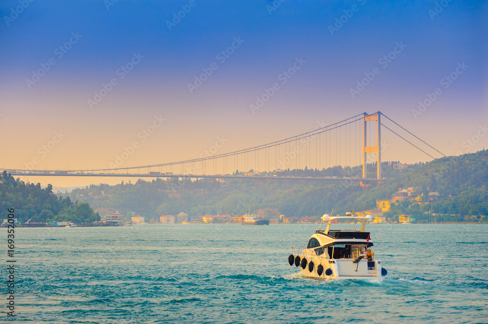 set of the ships passes across the canal Bosphorus, on a background the bridge through the passage, Istanbul