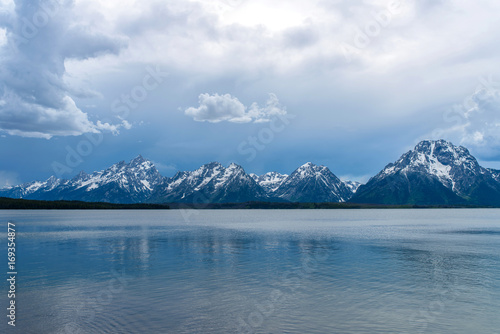 Εκτύπωση καμβά Stormy Mountain Lake - Spring afternoon storm clouds moving over Jackson Lake, with Teton Range rising in the background, Grand Teton National Park, Wyoming, USA