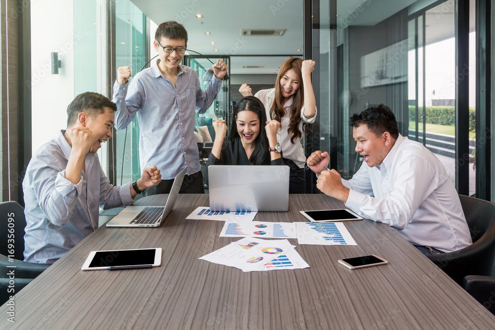 Group Of AsianBusiness people with casual suit working with happy action and celebrate in the modern Office, people business group concept