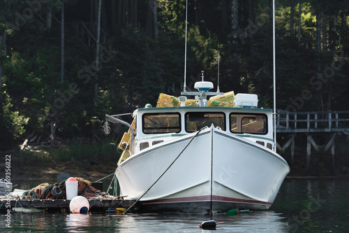 Lobster boat moored in early autumn in South Bristol, Maine, United States