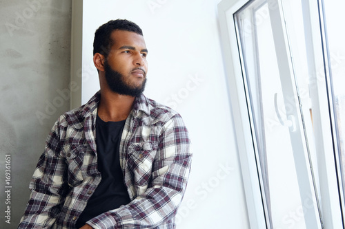 Portrait of Arabic hipster male in a fleece shirt.