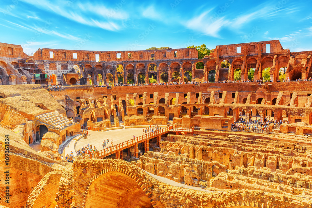 Tourist's Inside the amphitheater of Coliseum in Rome- one of wonders of the world  in the morning time.