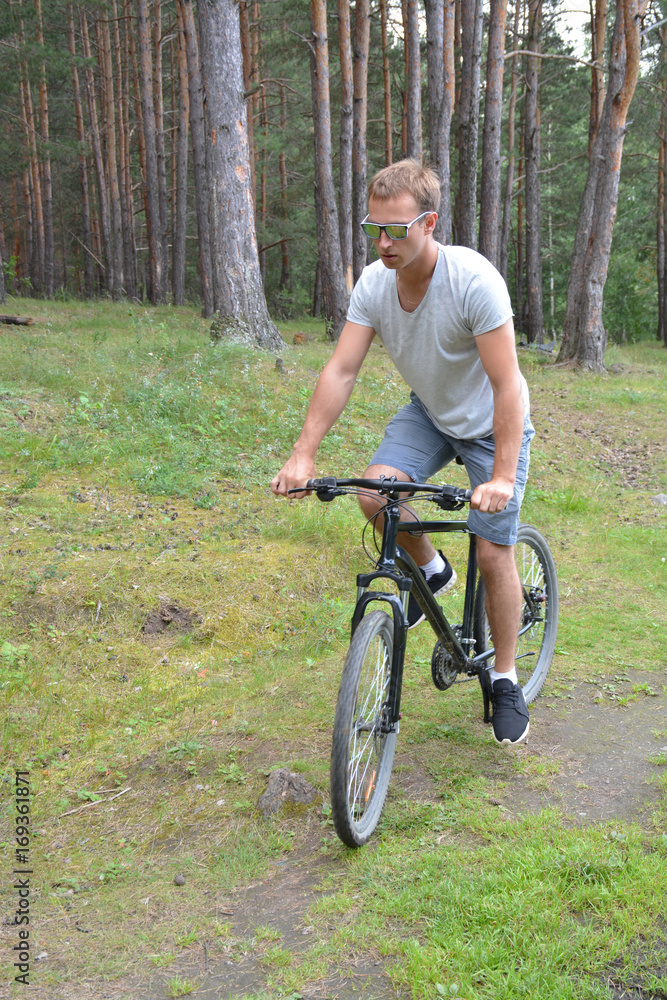 a cyclist on a mountain bike rides through the carriageway along the asphalt road. A healthy lifestyle. A lovable sports hobby
a cyclist on a mountain bike rides through the carriageway along the asphalt road. A healthy lifestyle. A lovable sports hobby
