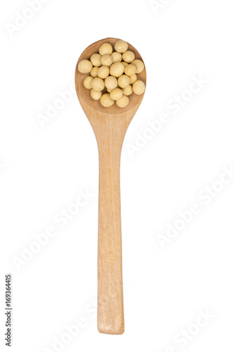Dried soy beans in a wooden spoon.