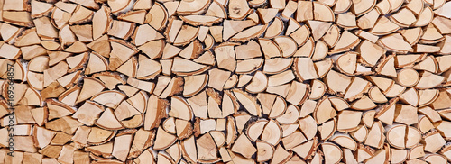 Wooden background of shattered tree trunks