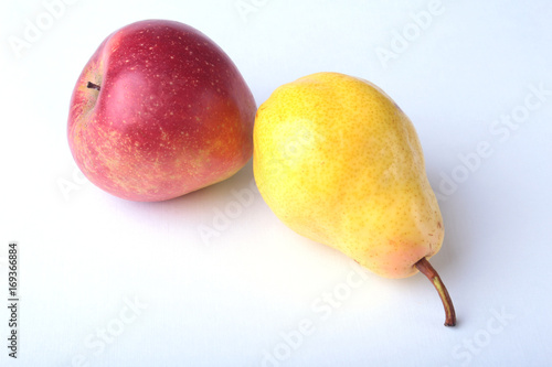 Fresh organic fruits isolated on white background. Assorted apple and pear. photo