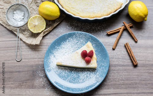 Fototapeta Naklejka Na Ścianę i Meble -  Homemade cheesecake with raspberries and lemon. Delicate dessert for coffee