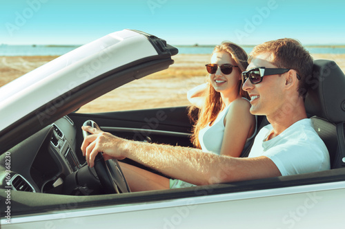 Young couple traveling by car