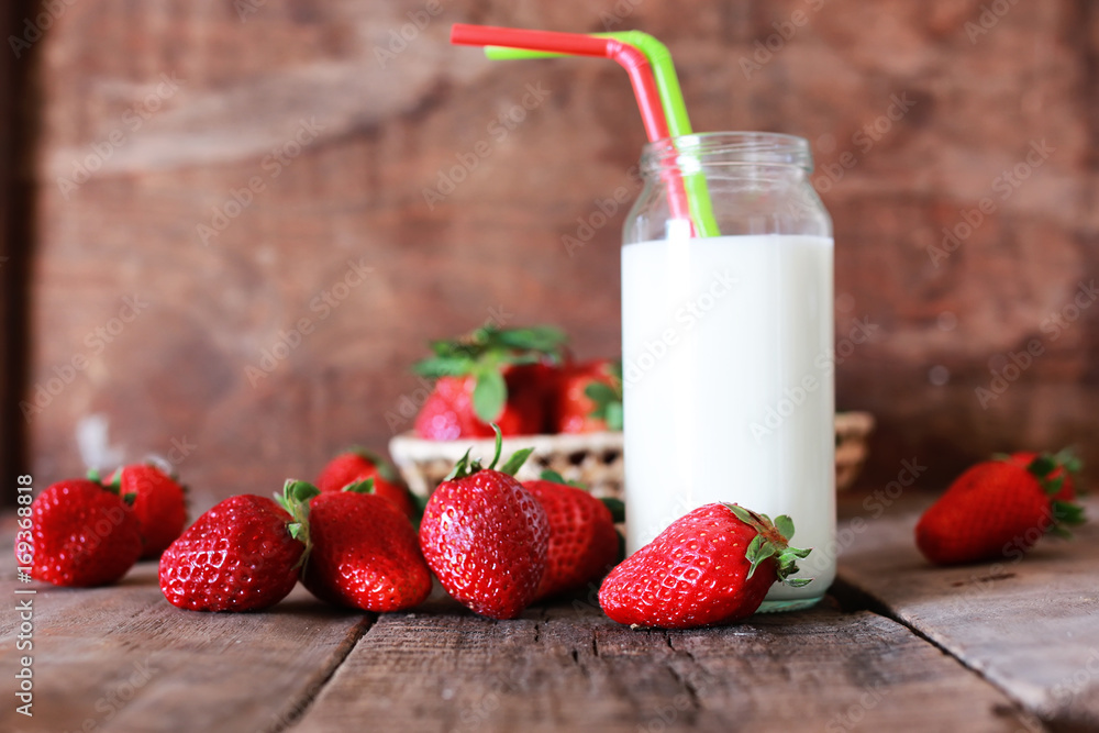 strawberries and milk in a glass strawberries and milk in a glass