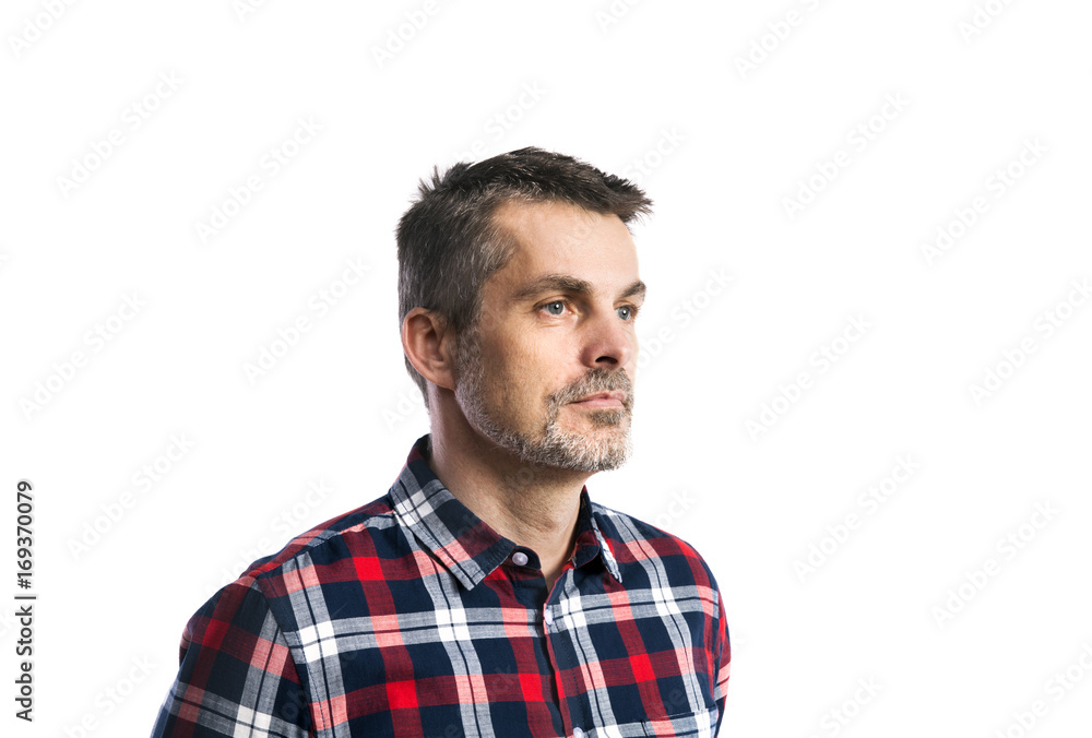 Mature hipster man in checked shirt. Studio shot, isolated. Mature hipster man in checked shirt. Studio shot, isolated.