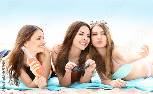 Beautiful young women takin...
