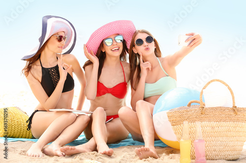Beautiful young women takin...