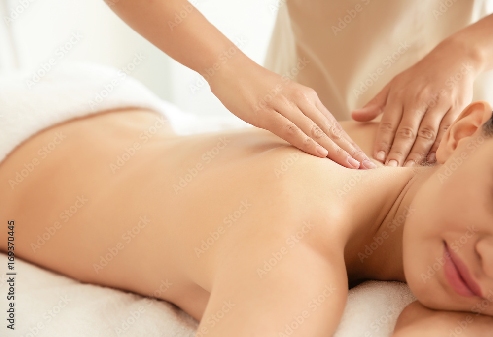 Young beautiful woman having massage in spa salon Young beautiful woman having massage in spa salon