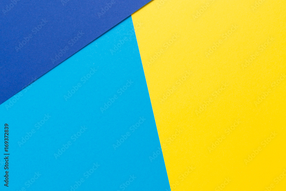 Color papers geometry flat composition background with yellow and blue tones Color papers geometry flat composition background with yellow and blue tones