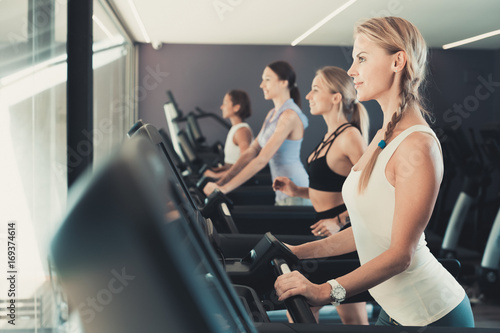 Women running on treadmills
