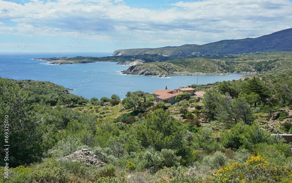 Spain Costa Brava rocky coastal landscape with an house near Cadaques, Guillola bay, Mediterranean sea, Cap de Creus, Catalonia